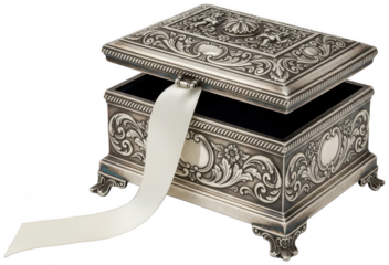 Open antique silver jewelry box revealing dark velvet interior and white ribbon draped outside