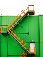 multi-span staircase on the facade of a green building