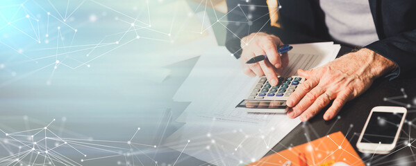Hand using calculator, accounting concept; panoramic banner