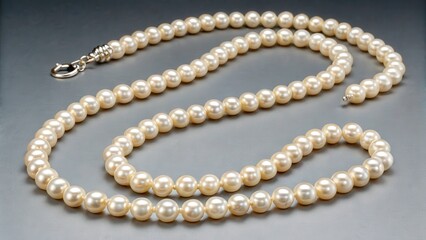 Elegant pearl necklace displayed on a dark surface in a well-lit setting for viewing