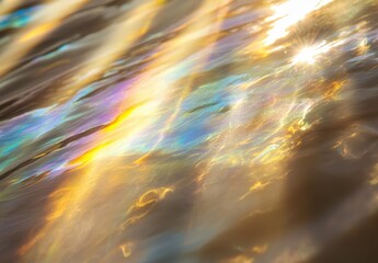 A shimmering surface of water reflecting a spectrum of colors, creating a mesmerizing play of light and patterns.