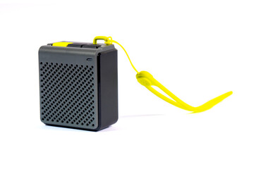 Wireless music speaker isolated on white. A modern grey audio gadget with yellow details, perfect for technology and entertainment concepts.