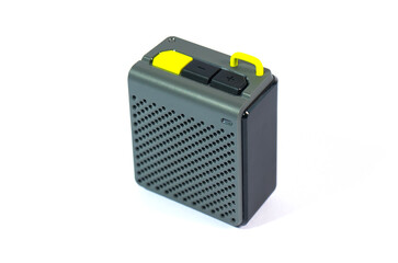 Wireless music speaker isolated on white. A modern grey audio gadget with yellow details, perfect for technology and entertainment concepts.