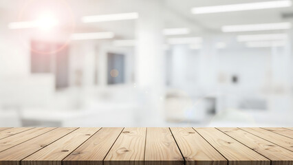 Empty wooden table top with blurred white interior background