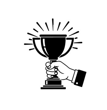 A hand holding a trophy cup with a radiant glow around it