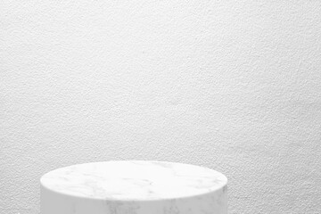 White Marble Product Display Stand on Concrete Wall Background.