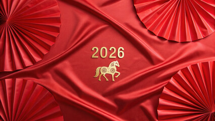 Chinese new year 2026 celebration with golden horse symbol on red silk fabric and decorative paper fans creating festive mood