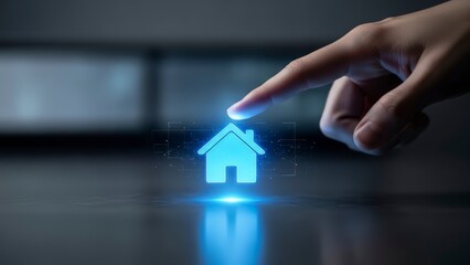 Hand interacting with glowing blue house icon on dark surface