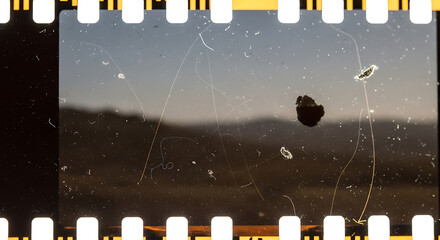 Vintage Film Strip Illustration of a Scratched Landscape Scene with Dust and Debris