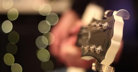 Caucasian male hands playing electric guitar closeup. Teacher teaching how to play on music instrument. Music, creativity and self education. Background concept