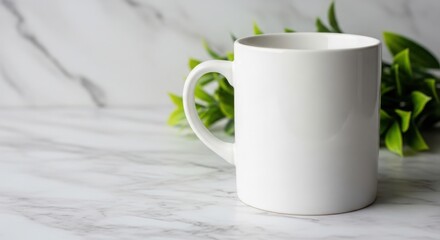 Blank white coffee mug with greenery mockup for design