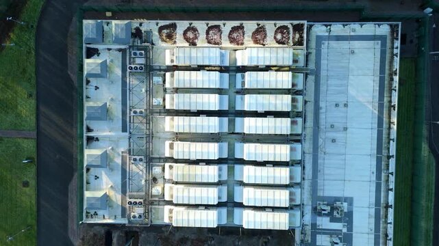 Birmingham, United Kingdom - 31 December 2025: Aerial view of the ATOS Long Bridge Data Centre showing the stark roof against the lush green surroundings.