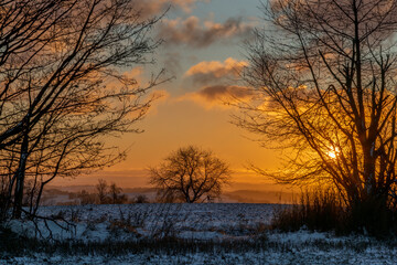 Winter snowy cold sunrise near Roprachtice village in Krkonose mountains