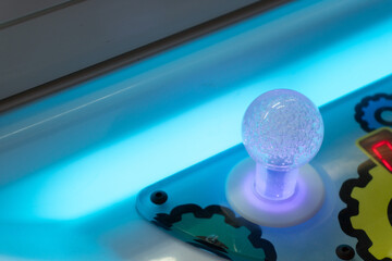 Arcade Dreams Illuminated Joystick in Neon Light with Entertainment Closeup.