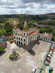 Historic town square in Brazil with colonial church and surrounding urban landscape