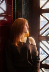 portrait of young woman with red hair