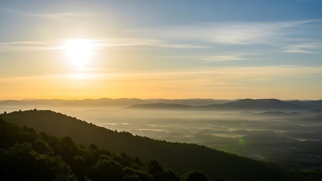 Sunrise over rolling hills with misty valley below green trees on slope - Powered by Adobe