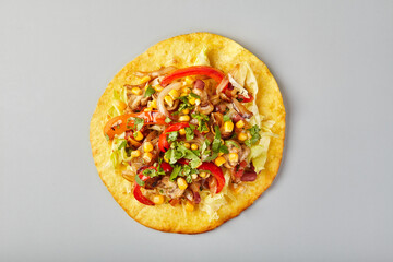 Fajitas in tortilla with chicken, cheese, bell pepper, corn and lettuce