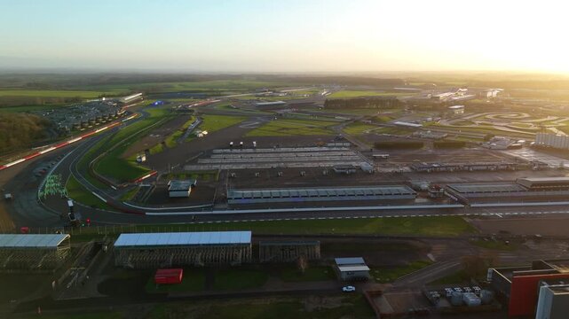 Towcester, United Kingdom - 20 December 2025: Aerial view of Silverstone Circuit, bathed in the golden light of dusk, showcasing its iconic track layout.