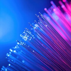 Abstract Close Up Of Illuminated Fiber Optics Strands Glowing With Blue And Pink Light Against Dark Background With Bokeh Effect