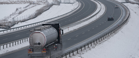 SNOWY AND FROSTY WINTER - Car traffic on the expressway on the claered of snow and not slippery