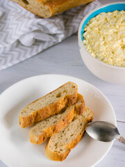 Whole grain baguette made from buckwheat flour and sesame seeds, and salad with egg
