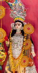 festival Saraswati idol showcasing traditional craftsmanship and devotion at Saraswati puja celebration