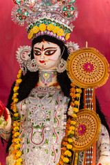 saraswati idol displayed during traditional festival honoring craftsmanship