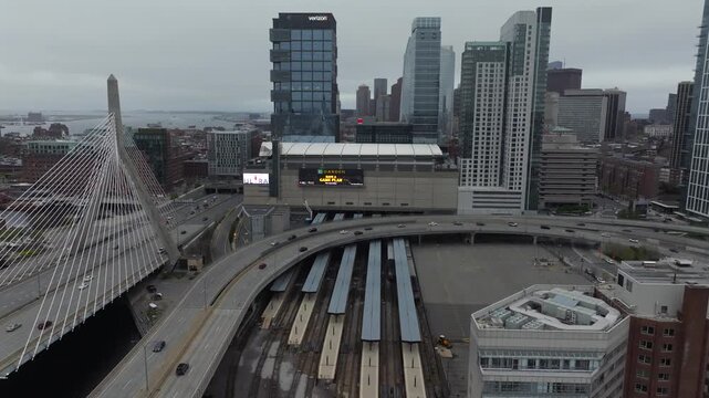 Boston, United States - 24 December 2025: Aerial view of the Leonard P. Zakim Bunker Hill Memorial Bridge and the cityscape under a gloomy sky.