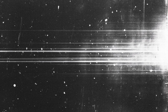retro film overlay effect with scratch dust and bokeh light leaks,retro grain noisy film distressed light leak flare on black background,black and white abstract background,Abstract old film texture