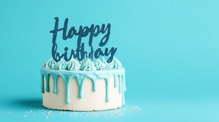 Cake with Blue Drip Icing and "Happy Birthday" Topper on Turquoise Background