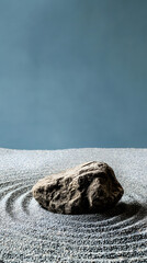meticulously designed Zen rock garden in a Buddhist temple vertical - blue background