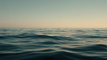 Obraz premium Calm Ocean Waves Under Soft Light at Dusk for Tranquil Scenes