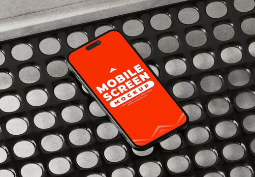 Sleek Smartphone Mockup on Metallic Surface with Industrial, High‑Tech Aesthetic