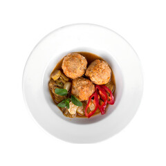 Delicious meatball stew with vegetables isolated on white background