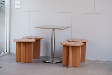 A modern-designed wooden table and chair set.