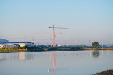 A crane is used for constructing buildings.