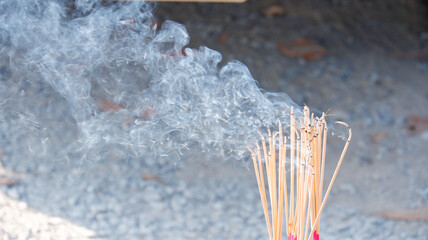Smoke rises from the incense that is lit to worship sacred beings and make a wish.