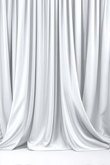 White draped fabric hangs artistically with soft light and deep shadows