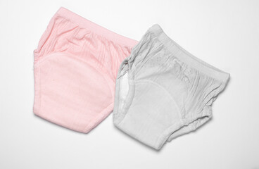 Baby panties diapers on white background. Top view