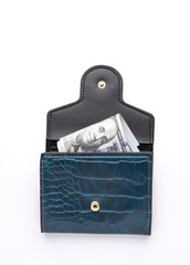 Crocodile leather wallet with hundred dollar bills on white background