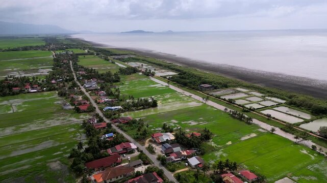 A town with houses and a beach. Aerial Kampung Kangkong, Kedah