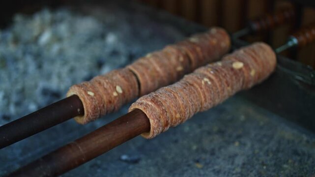 Traditional Czech trdelnik pastry cooking in Prague.