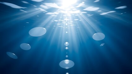 Sunlight filtering through ocean water with jellyfish