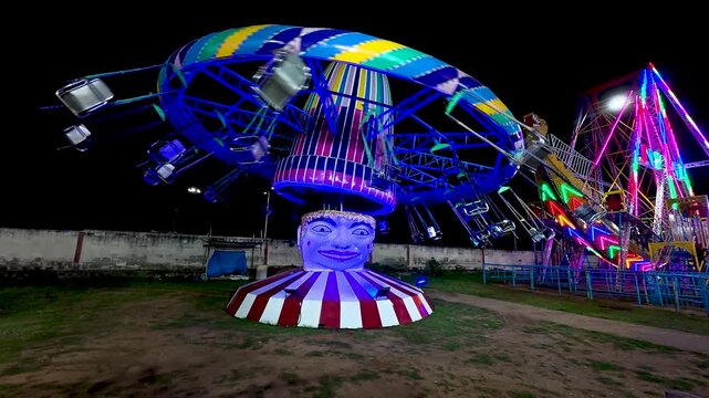 Mysuru, Karnataka, India-October 27 2025; An Amusement park with joy rides for the children and tourists during Dussehra festival carnival in India.
