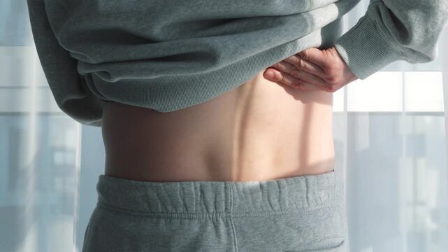 Lower back pain in a man standing in a bright room during the day.
Herniated disc in a man's back.
Treatment for back injuries and recovery from contusions