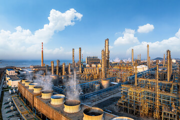 Massive oil refinery and chemical plant processing energy in a coastal industrial zone under a...