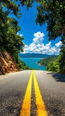 Scenic Coastal Road to Paradise with Lush Tropical Landscape and Blue Ocean View