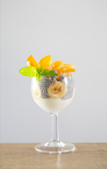 chia pudding with berries and yogurt on white background