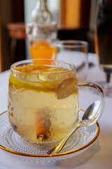 glass cup of tea with lemon on table